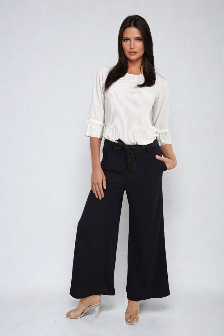 Woman modeling Belted High Waist Wide Leg Trousers, showcasing a trendy silhouette with a belted design and wide leg fit, representing stylish, versatile fashion.