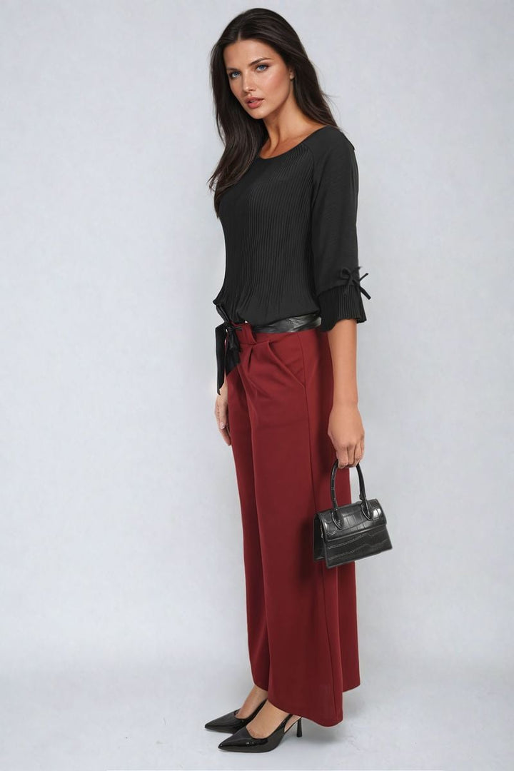 Woman models the Belted High Waist Wide Leg Trouser, showcasing its flattering fit and trendy design, embodying chic style for versatile occasions.