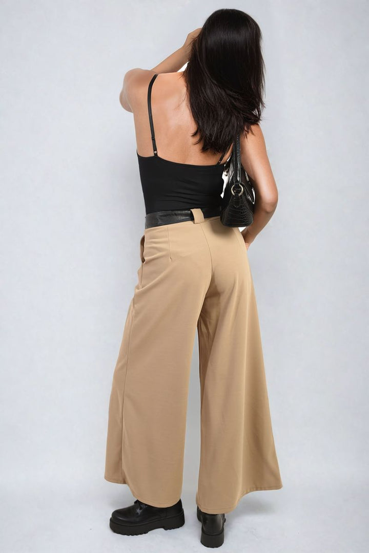 Woman wearing Belted High Waist Wide Leg Trouser, showcasing a stylish and comfortable fit, perfect for versatile and chic holiday or everyday looks.