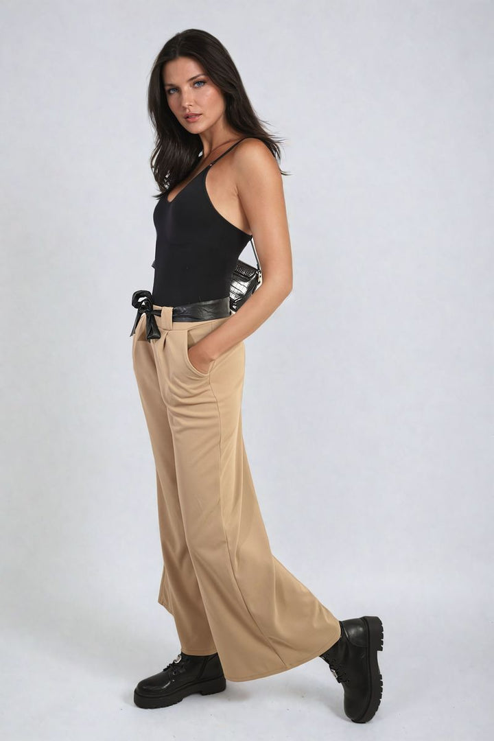 Woman modeling Belted High Waist Wide Leg Trouser, showcasing its stylish fit and flattering silhouette, ideal for versatile holiday and everyday wear.