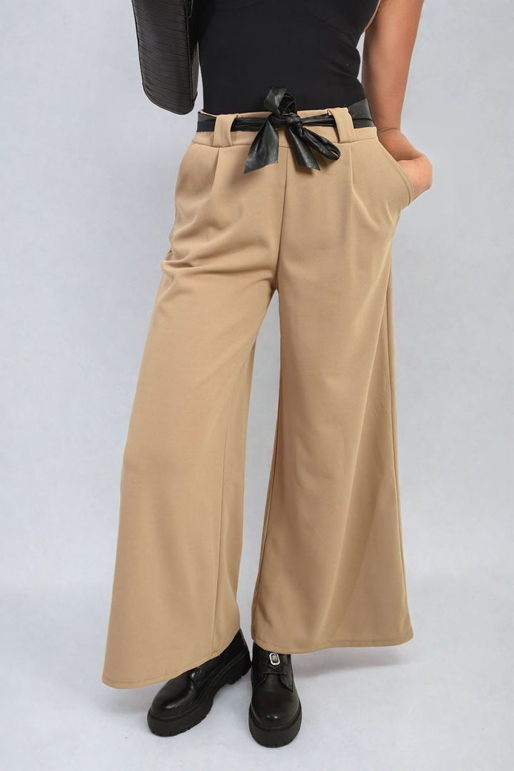 Woman wearing Belted High Waist Wide Leg Trousers with a black belt, offering a stylish silhouette and trendy wide-leg design, ideal for versatile occasions.