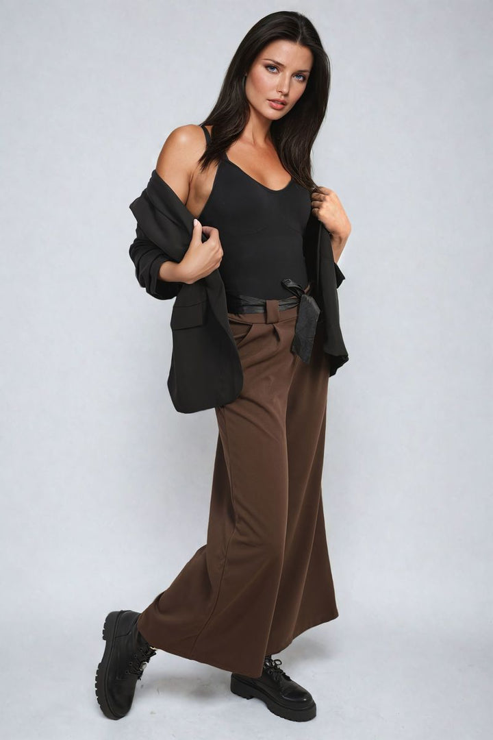 Woman wearing Belted High Waist Wide Leg Trouser, showcasing its high waist and wide leg style, perfect for chic and versatile holiday or everyday wear.