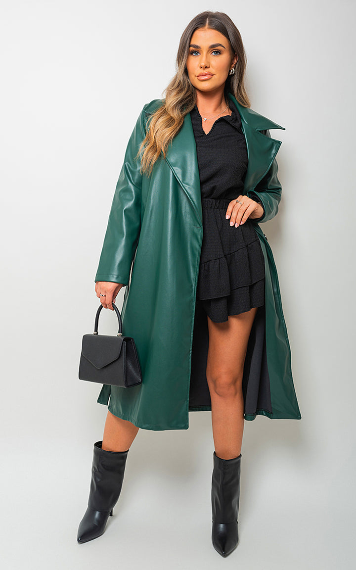 Woman in a Longline Belted Trench Coat holding a black bag, showcasing a stylish and versatile outerwear option from Holiday Clothes UK.