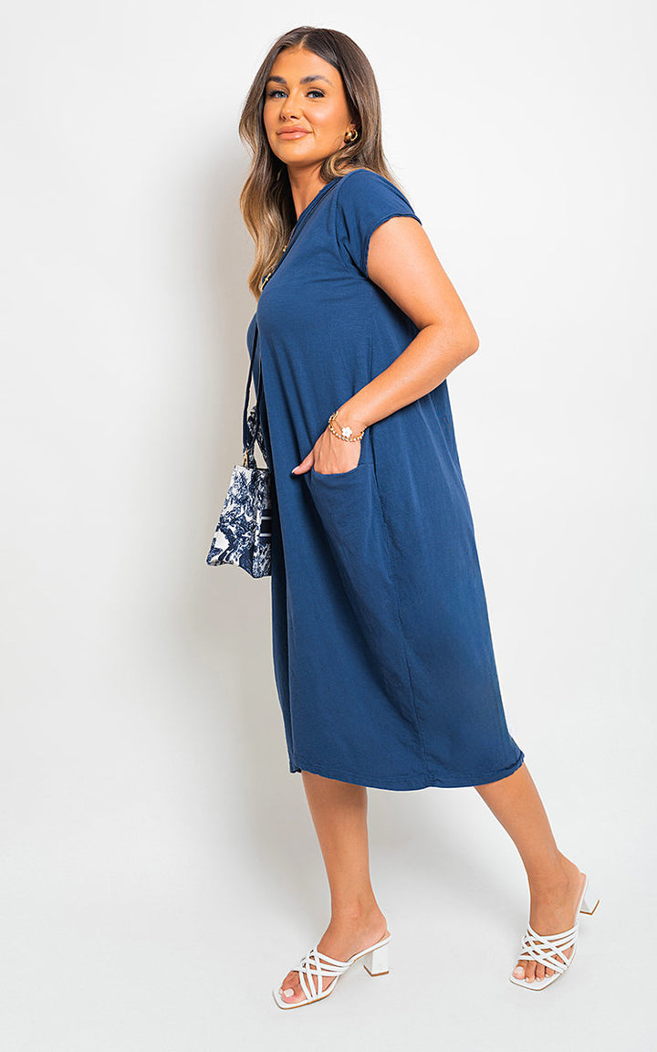 Front Pockets Short Sleeve Midi Dress on woman, showcasing its elegant fit and practical front pockets, ideal for versatile holiday and everyday wear.