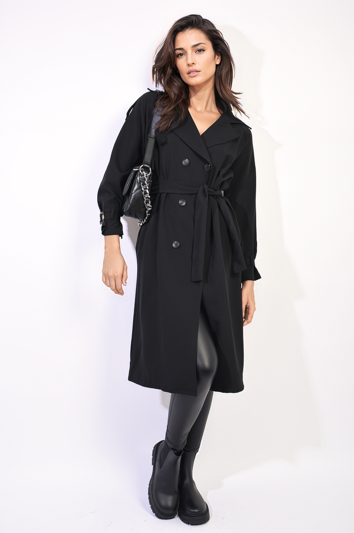 Woman wearing a Waist Tie Button Detailed Trench Coat, accessorized with black rain boots and a black purse. Perfect for stylish, versatile weather protection.