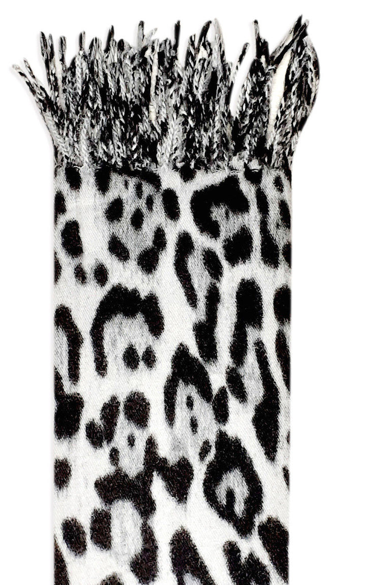 Leopard Detail Scarf with a black and white animal print, showcasing a soft knitted texture ideal for pairing with casual jackets and jeans.