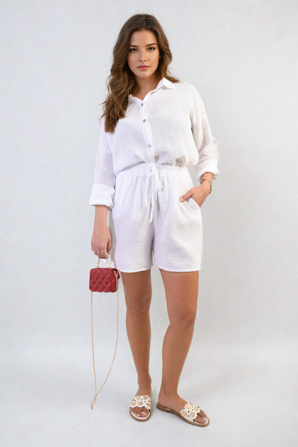 Woman wearing the Oversized Button Front Shirt and Shorts Co-ord Set, holding a red purse, showcasing a relaxed and trendy look.