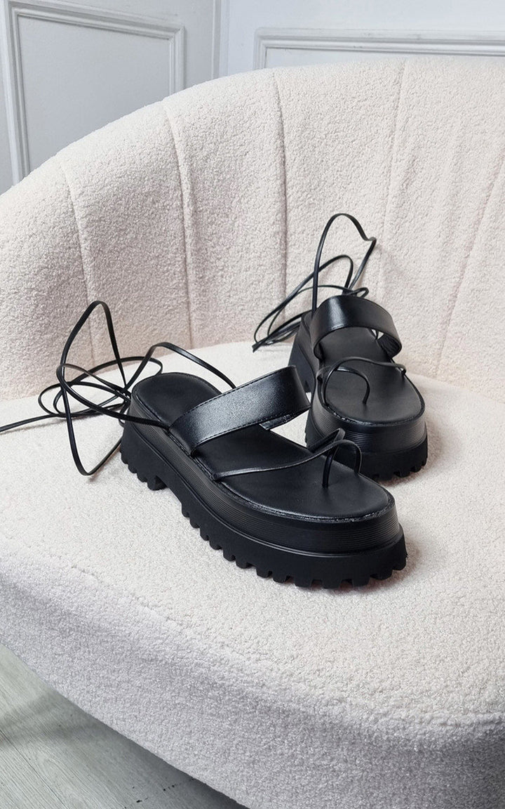 Faux Leather Strappy Lace Up Sandals featuring durable faux leather and statement strap details, perfect for adding glamour and secure comfort to your holiday wardrobe.