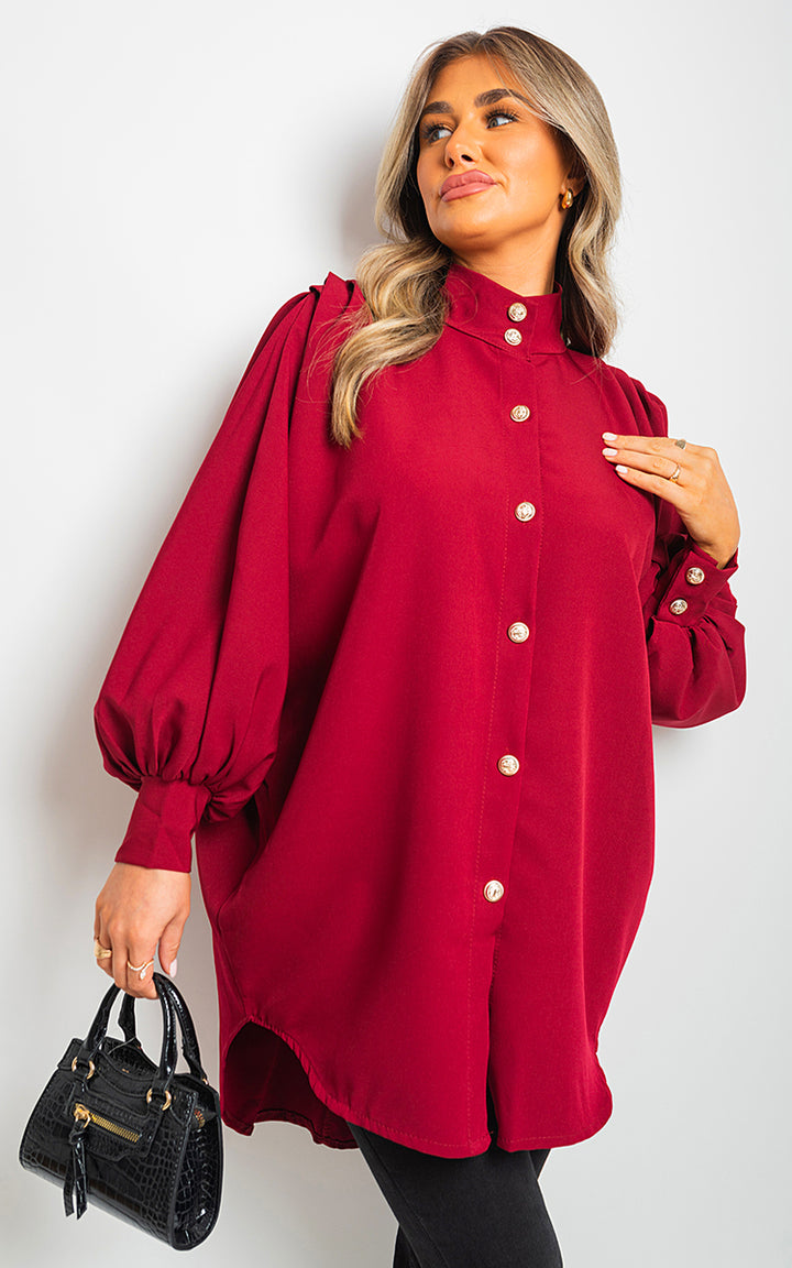 Oversized High Neck Shirt on woman, paired with a black purse, showcasing its relaxed fit and stylish design for versatile, everyday fashion.