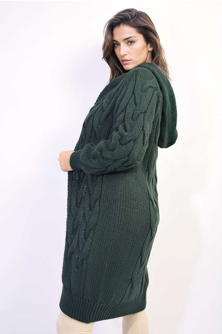 Woman wearing the Zoe Chunky Cable Knitted Oversized Longline Hooded Cardigan, showcasing its cozy and layered style, perfect for casual and stylish holiday attire.