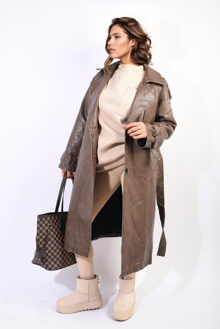 Woman in Lapel Neck Belted Trench Coat Jacket, showcasing its sophisticated design with a lapel neck, belted waist, and practical features for transitional weather.