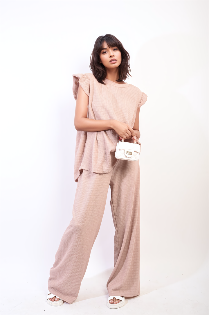 Ruffle Trim Top and Wide Leg Trouser Co-ord Set with white purse, showcasing elegant and contemporary design for stylish holiday attire from Holiday Clothes UK.