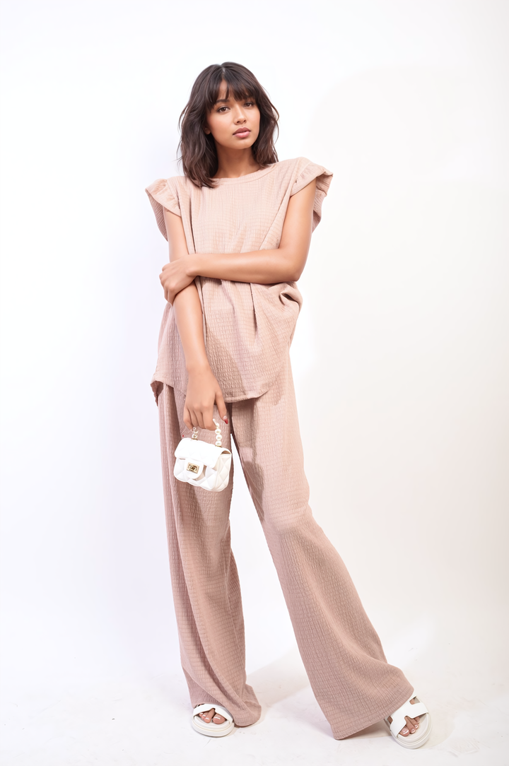 Woman showcasing the Ruffle Trim Top and Wide Leg Trouser Co-ord Set, highlighting its elegant design and sophisticated style, perfect for various occasions.