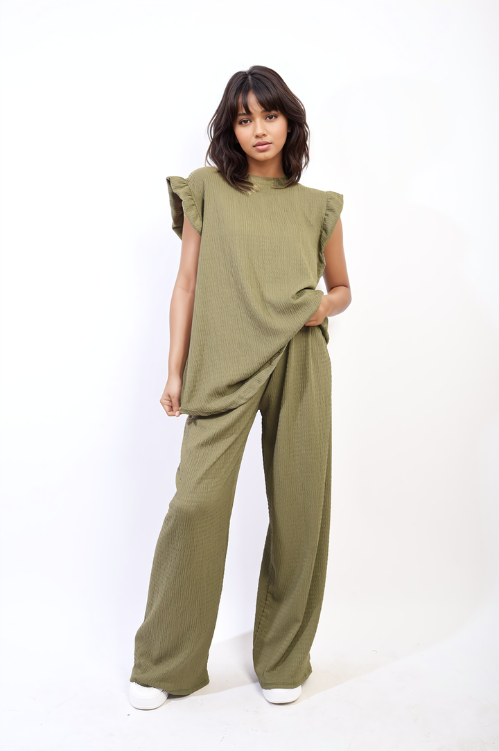 A woman models the Ruffle Trim Top and Wide Leg Trouser Co-ord Set, showcasing its elegant ruffle details and modern design.