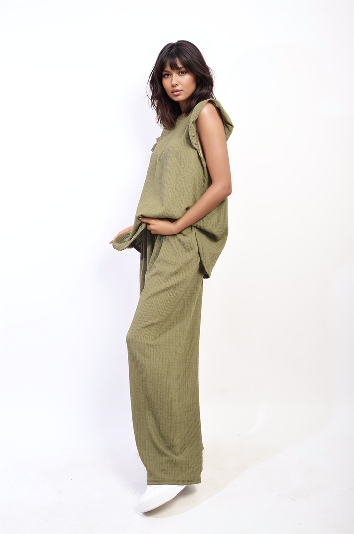 Woman wearing Nova Ruffle Trim Top and Wide Leg Trouser Co-ord Set, showcasing elegant, modern design with ruffle details and high-waisted trousers.