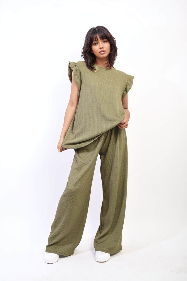 Woman modeling the Ruffle Trim Top and Wide Leg Trouser Co-ord Set, showcasing the outfit's elegant ruffle details and modern wide-leg design.