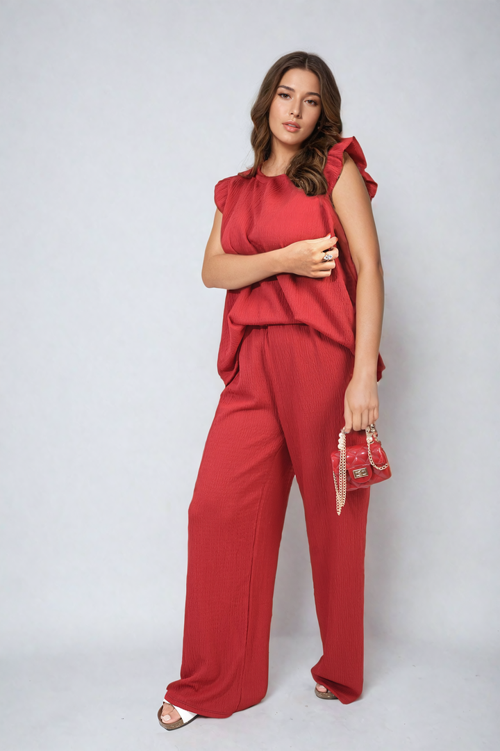 Ruffle Trim Top and Wide Leg Trouser Co-ord Set showcased by a woman, highlighting elegant design and modern style suitable for various occasions.