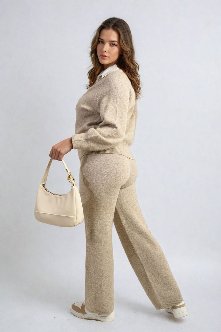 Woman models the Long Sleeve Knitted Collar Top and Wide Leg Pants Co-ord Set, holding a white purse, showcasing stylish comfort for everyday wear.