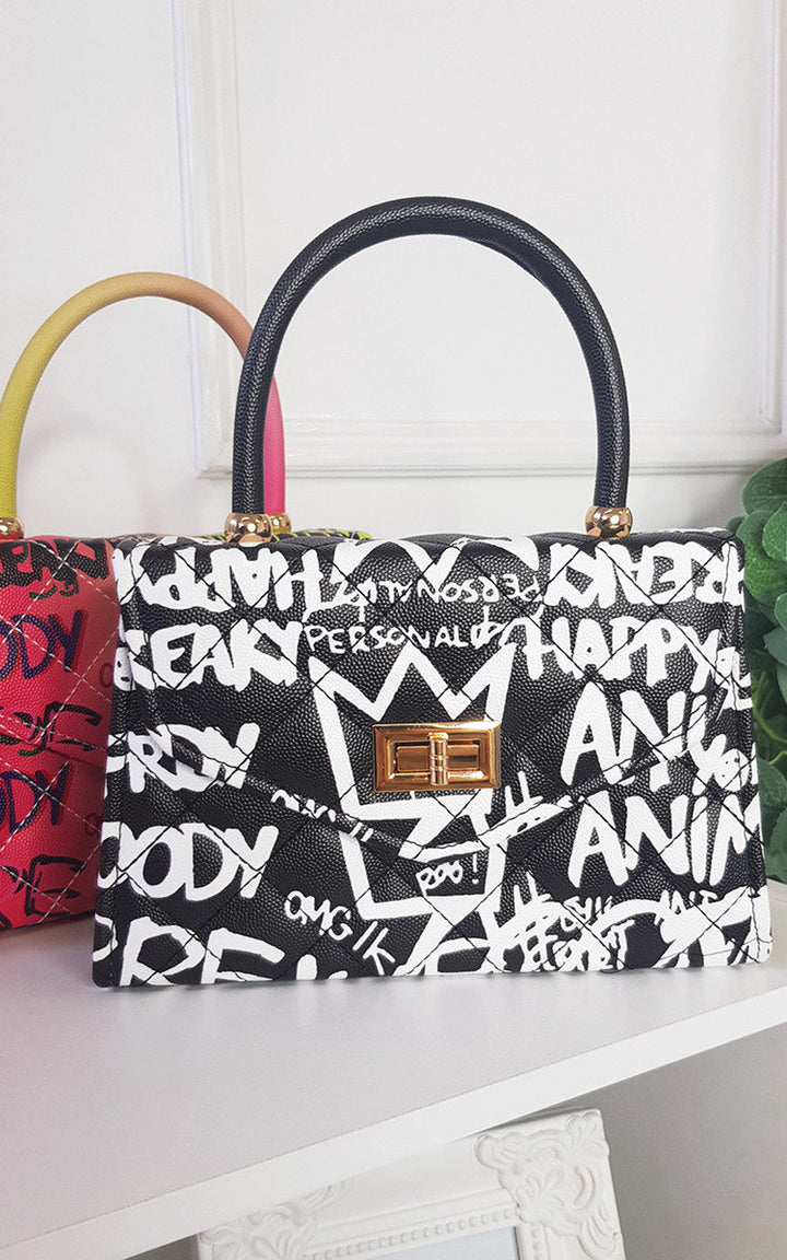 Graffiti Print Handbag with faux leather and clasp fastening, ideal for everyday use, featuring an all-over graffiti design.