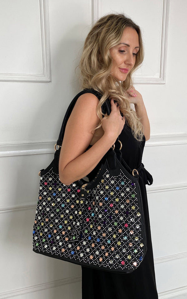 Woman holding a Printed Bag, a stylish faux leather handbag designed for versatility and durability, featured in an online women’s clothing store collection.