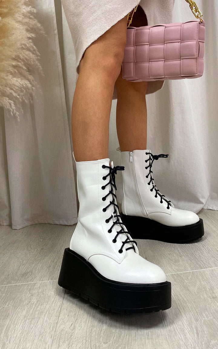 Lace Up Chunky Ankle Boots worn by a person, showcasing their stylish design and durable sole, ideal for daily wear and versatile occasions.