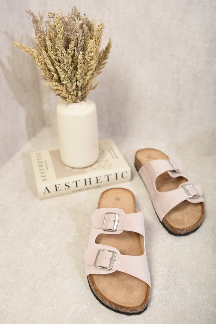 Double Strap Sandals with buckles next to a book, emphasizing comfort and style for summer outfits from Holiday Clothes UK. Perfect for chic holiday looks.