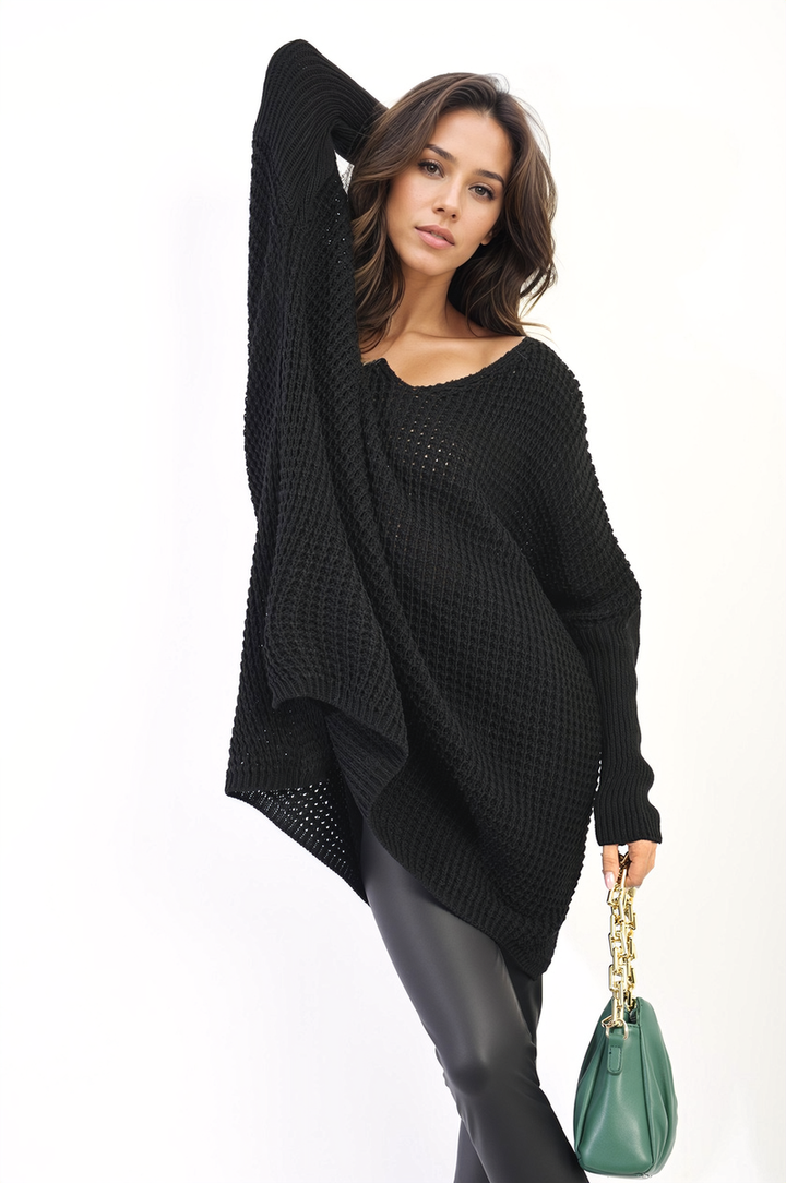 Woman wearing the Rebecca Oversized Chunky Knitted Jumper, showcasing its cozy, relaxed fit, perfect for casual outings or staying warm indoors.