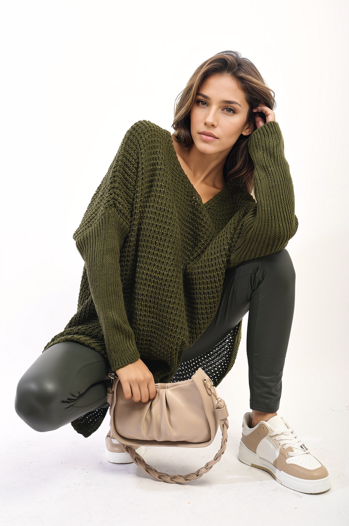 Woman wearing the Rebecca Oversized Chunky Knitted Jumper, showcasing its relaxed fit and cozy texture, ideal for casual outings or staying warm indoors.