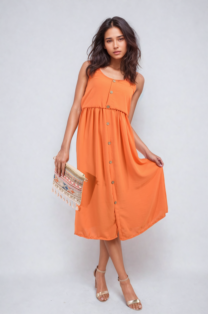 Woman in a Button Front Strappy Midi Dress holding a purse, showcasing a chic, summer-ready look with high heels, perfect for stylish holiday outings.