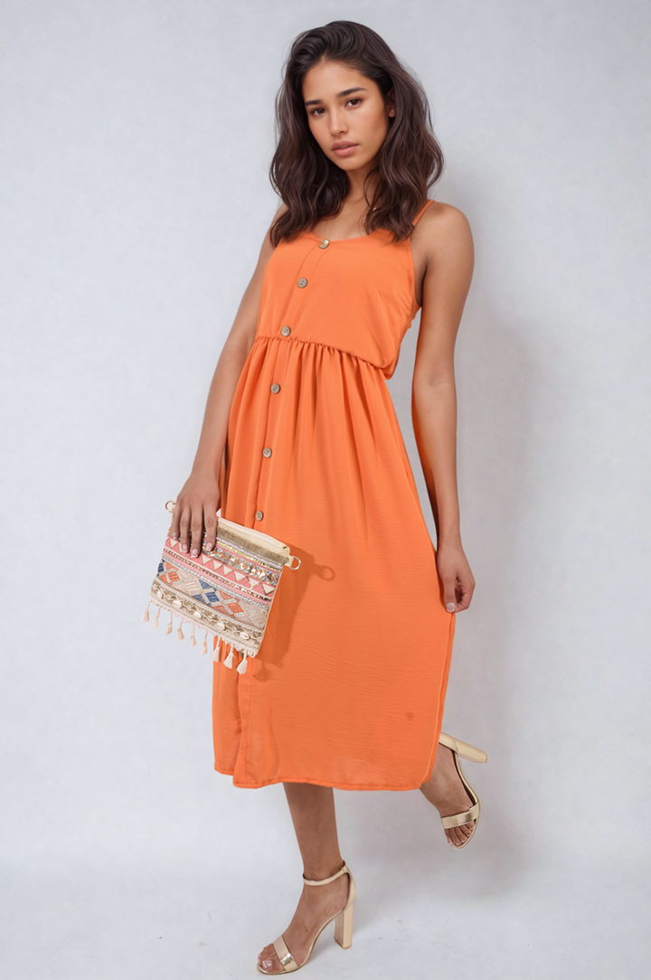 Woman in a Button Front Strappy Midi Dress, showcasing its elegant and trendy design, perfect for summer outings and versatile styling.