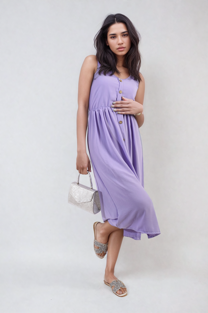 Woman modeling Button Front Strappy Midi Dress, showcasing its strappy design and button-front detail, embodying chic summer style.