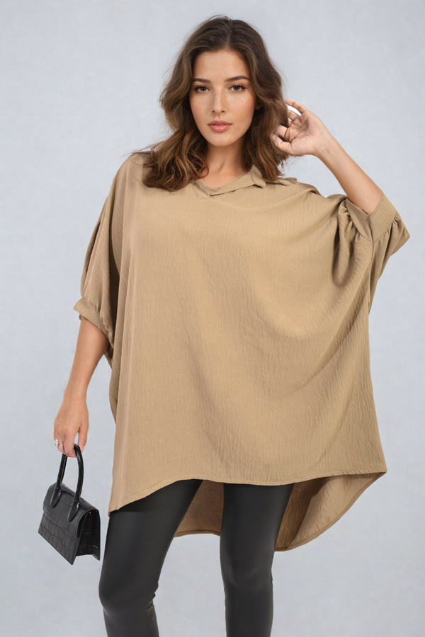 Woman wearing Balloon Sleeve Oversized Top, holding a black purse, showcasing stylish comfort and elegance from Holiday Clothes UK.