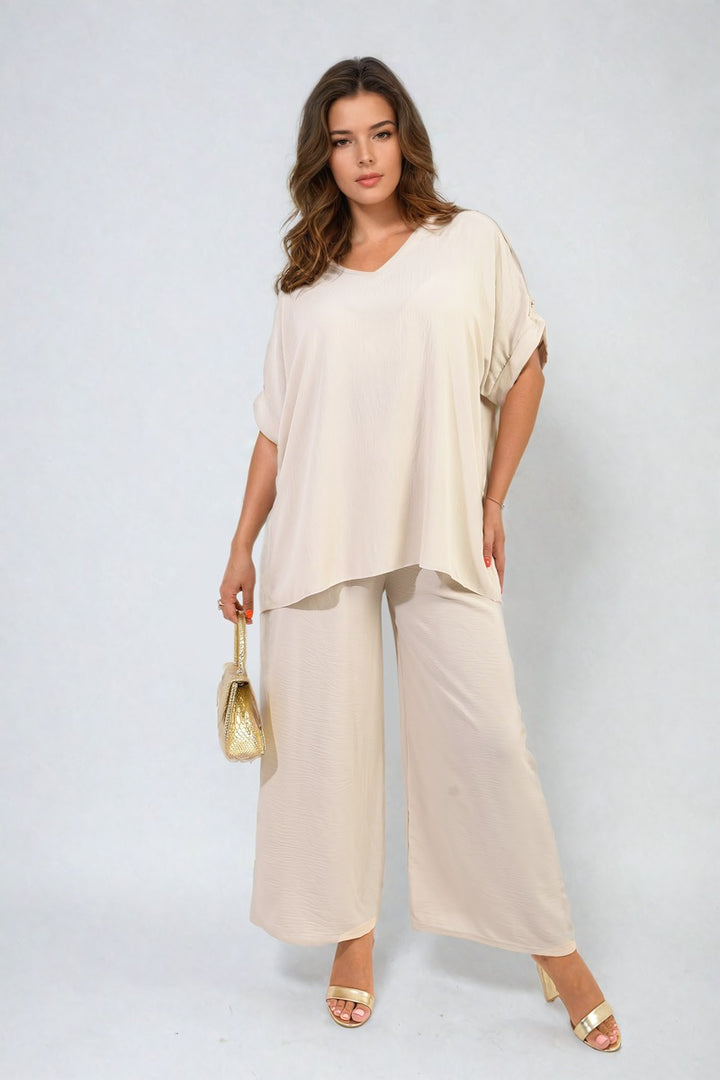 Riley Button Detail V Neck Loose Top and Wide Leg Trouser Co-ord Set, elegantly styled on a model, showcasing its breezy fit and sophisticated design.