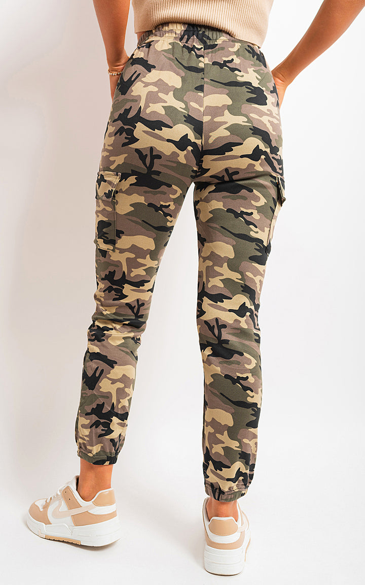 Camo Print Tie Cargo Trouser with adjustable tie waist and multiple pockets, worn by a person, showcasing stylish functionality and casual fashion.