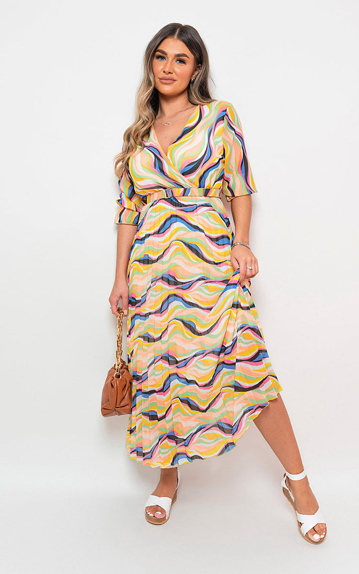 Long Sleeve Printed Maxi Dress with Belt Detail, worn by a woman, showcasing its elegant pattern and fit, ideal for versatile holiday occasions.