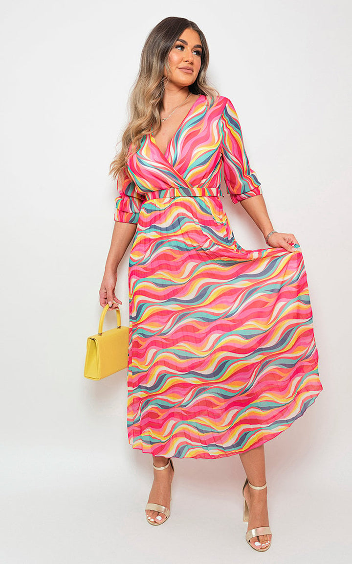 Woman wearing a Long Sleeve Printed Maxi Dress with Belt Detail, showcasing a stylish and comfortable design perfect for various occasions.