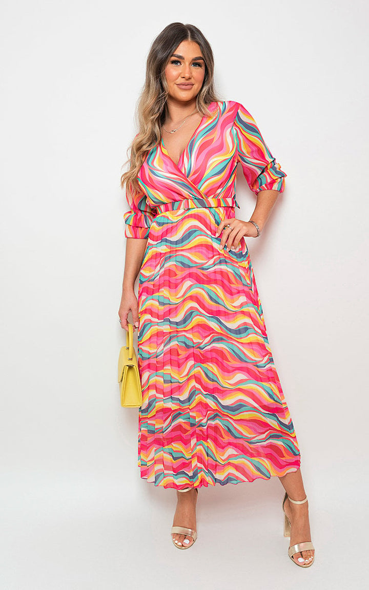 Woman wearing the Long Sleeve Printed Maxi Dress with Belt Detail, showcasing its elegant design and flattering silhouette, perfect for any occasion.