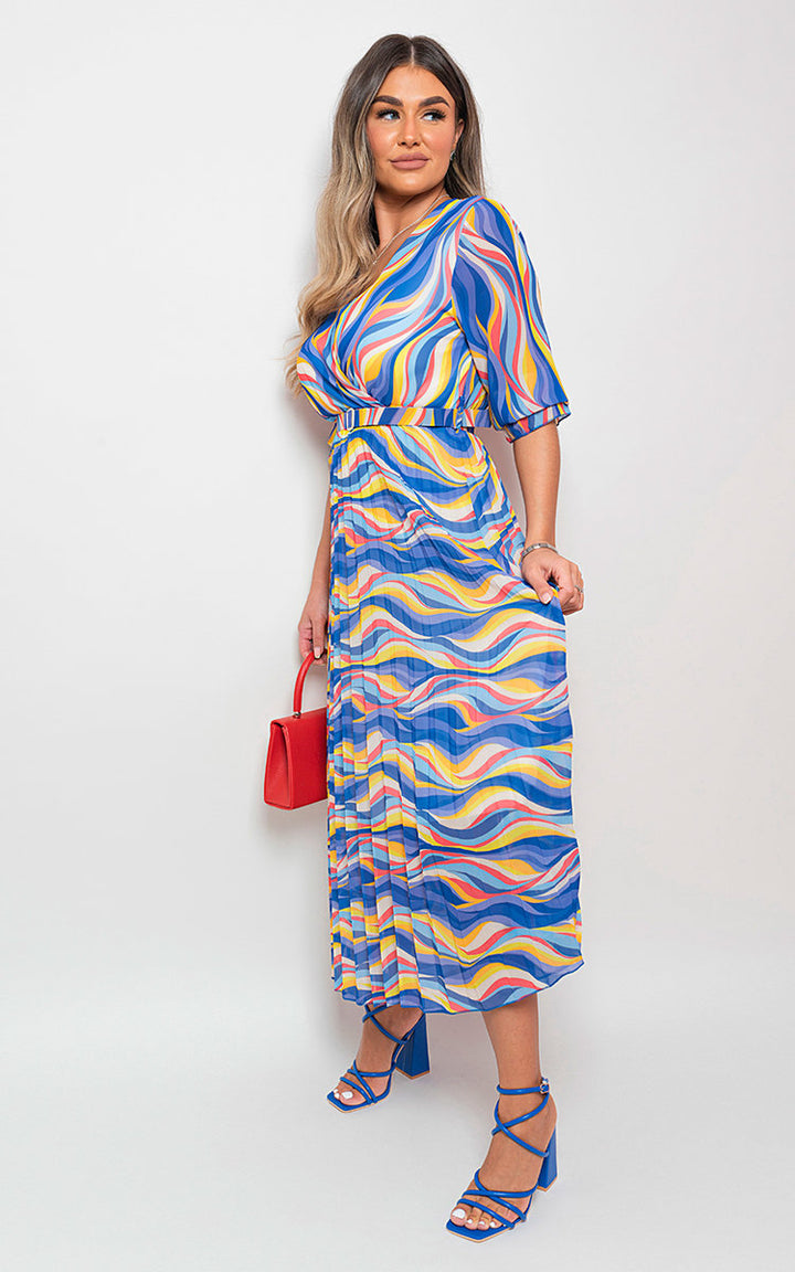 Woman wearing Long Sleeve Printed Maxi Dress with Belt Detail, showcasing its long sleeves and flattering maxi length, perfect for stylish occasions.