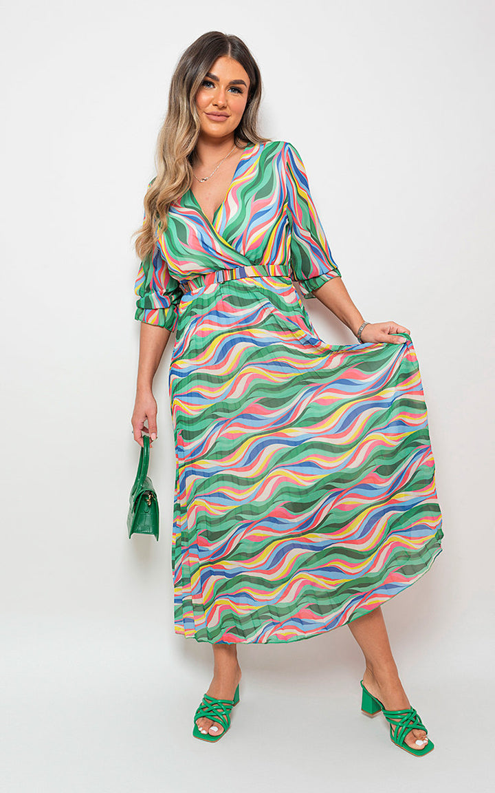 Woman wearing the Rosie Long Sleeve Printed Maxi Dress with Belt Detail, showcasing its long sleeves, print, and flattering maxi length.