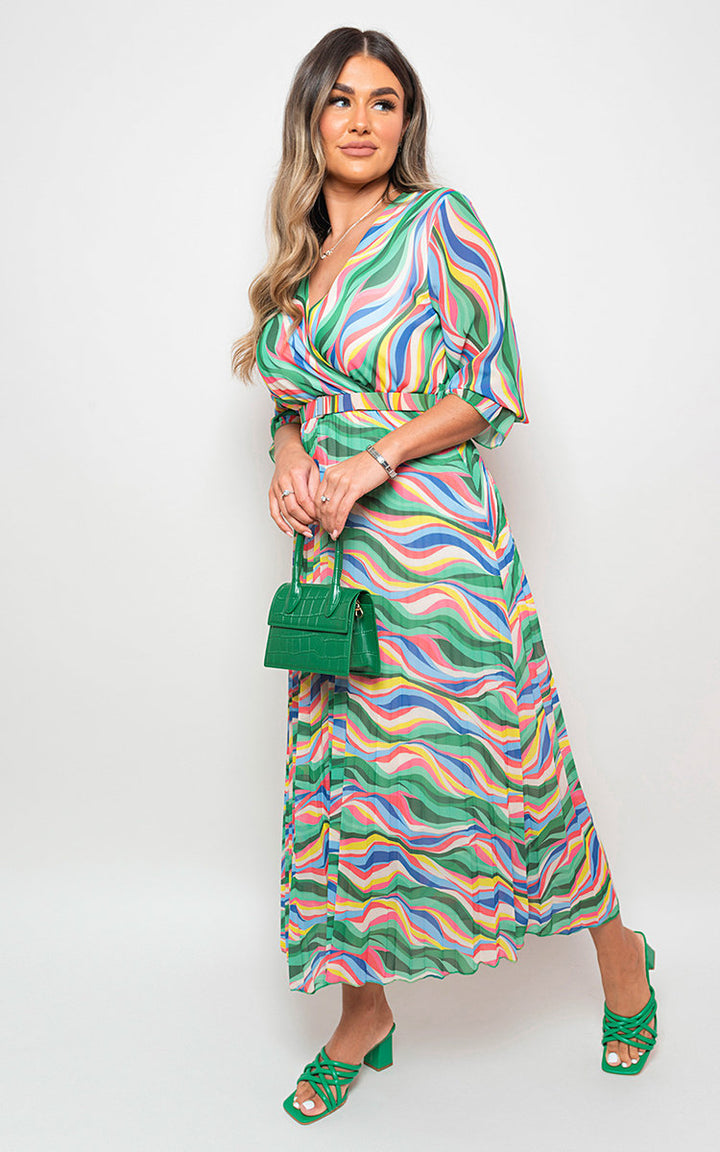 Woman modeling the Long Sleeve Printed Maxi Dress with Belt Detail, showcasing its flattering fit and stylish design, ideal for various occasions.