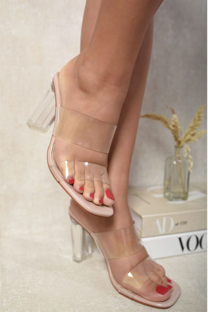 Transparent Double Strap Clear Block High Heels worn by a person, showcasing chic and versatile style for both casual and night outings.