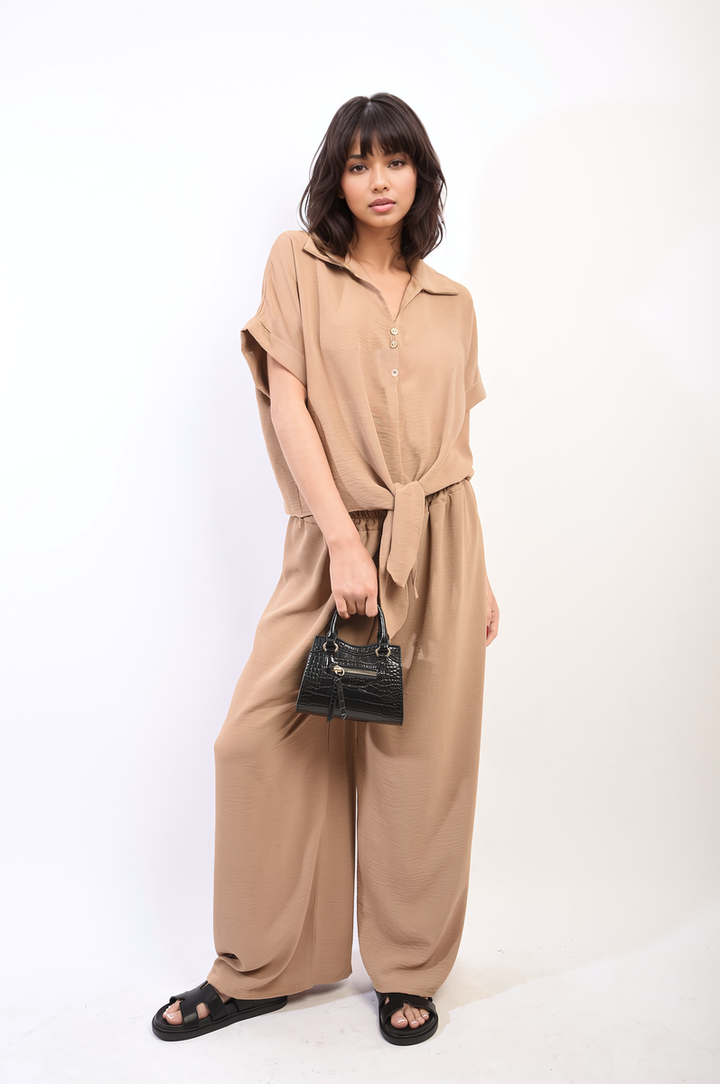 Woman modeling the Tie Front Top and Wide Leg Pants Co-ord Set, showcasing chic style and comfort, ideal for versatile holiday and everyday wear from Holiday Clothes UK.