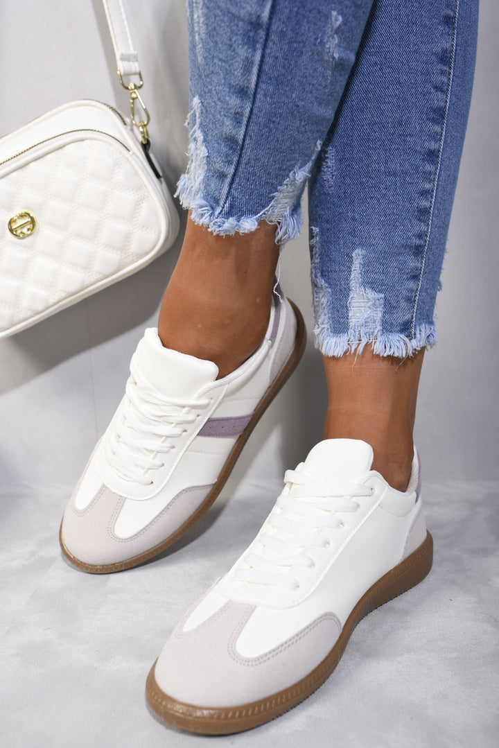 Contrast Panel Lace Up Gum Sole Trainers showcased with ripped jeans and white sneakers, highlighting their stylish and functional design for everyday use.