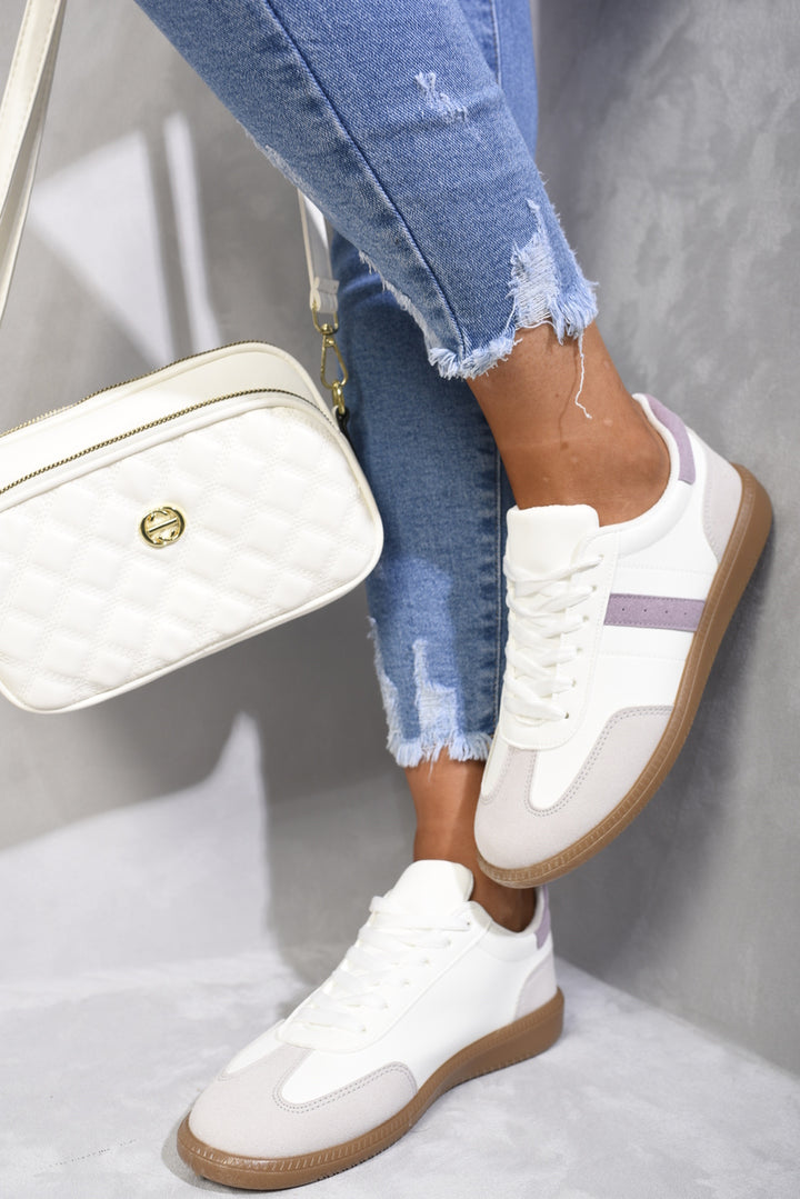 Contrast Panel Lace Up Gum Sole Trainers on a person wearing ripped jeans and white sneakers, highlighting their stylish, casual appeal.