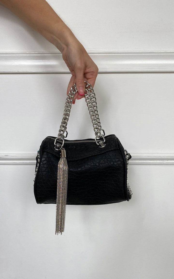 Hand holding the Studded with Chain Detail Handbag, featuring faux leather and silver stud accents, perfect for adding luxury to any fashionista's style.