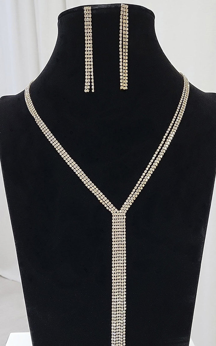 Samira Diamante Necklace and Drop Earrings Set displayed on a mannequin, showcasing elegant and glamorous jewelry perfect for enhancing any stylish woman's wardrobe.