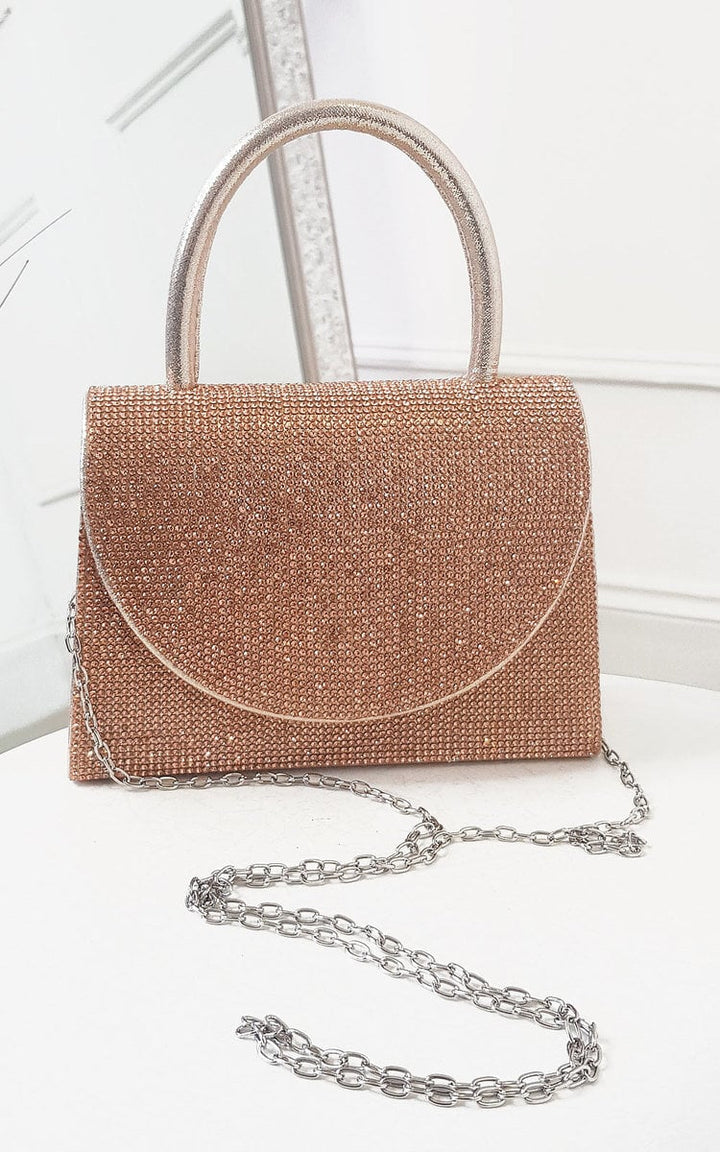 Diamante Embellished Handbag with silver handles and detachable chain strap, featuring a shiny finish and magnetic closure, ideal for stylish holiday occasions.