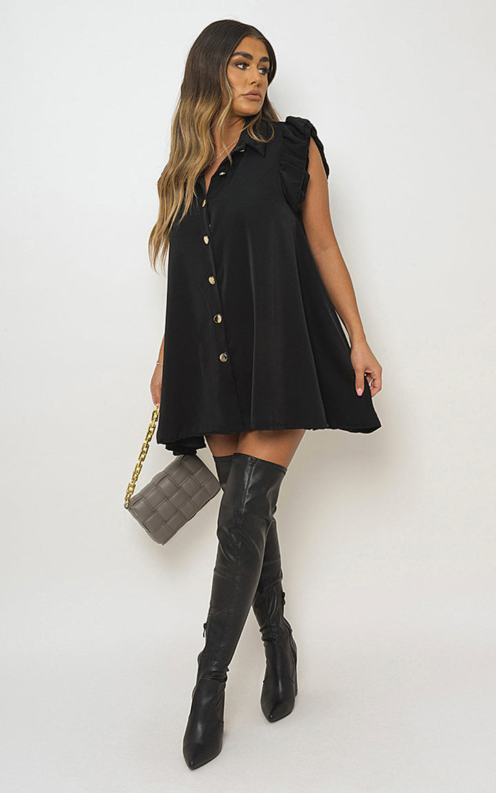 Gold Button Down Ruffle Sleeve Mini Dress on woman, styled with boots and grey purse, showcasing flirty design and mini silhouette, ideal for versatile holiday looks.