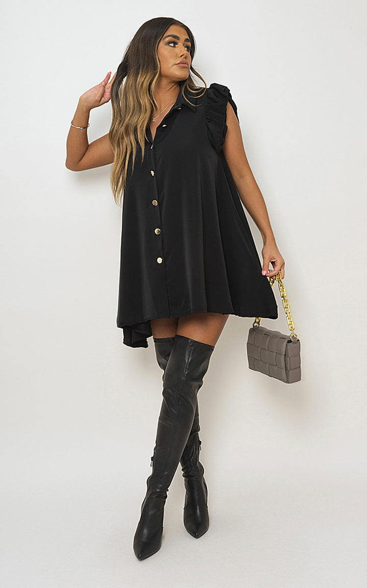 Gold Button Down Ruffle Sleeve Mini Dress worn by a woman with knee-high boots, showcasing a flirty mini silhouette and ruffled sleeves.