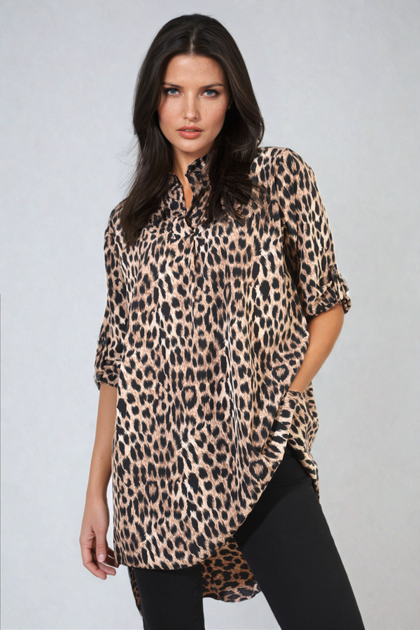 Woman wearing an Oversized Leopard Print Button Down Batwing Sleeve Top, showcasing its stylish, relaxed fit ideal for everyday or casual outings.